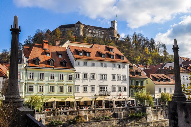 Historic Ljubljana Tour with Ljubljana Castle included - Old Town start: Cathedral, Robba Fountain, Town Hall, and the bridge network